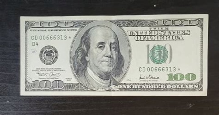 How did Jamal know whose picture was on the American $100 bill?