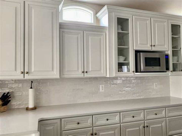 Should I paint my cabinets the same white as my walls?