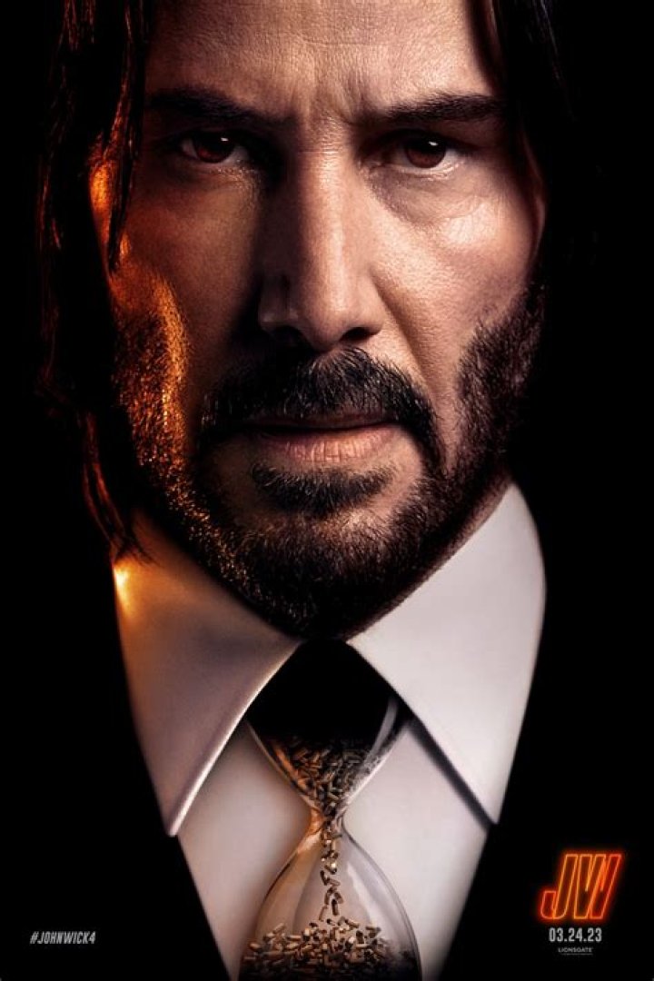 What is tattooed on the neck of the adjudicator in John Wick 3?