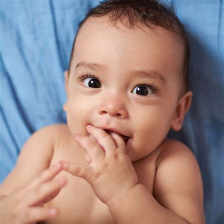 Why do babies put their hands in your mouth while breastfeeding?